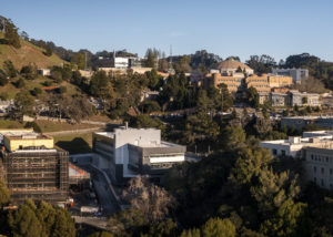 An aerial view of Lawrence Berkeley National Laboratory (Berkeley Lab) showing the construction site for the BioEPIC project (left), the Integrated Genomics Building (IGB, Building 91), The Advanced Light Source (ALS) on the hill behind the IGB, and to the right the Building 50 complex, Buildings 70, and 70A, in Berkeley, California, 02/06/2023.